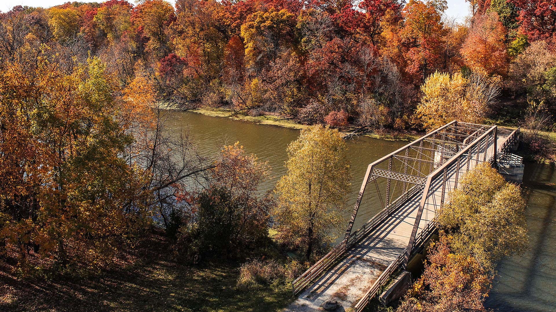 Fall colors and bridge over Crawfish River at Astico Park Columbus Wisconsin