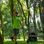 Man disc golfing at Brand-Quirk Park in Watertown Wisconsin