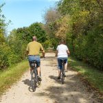 Couple bicycling on Wild Goose State Trail in Dodge County