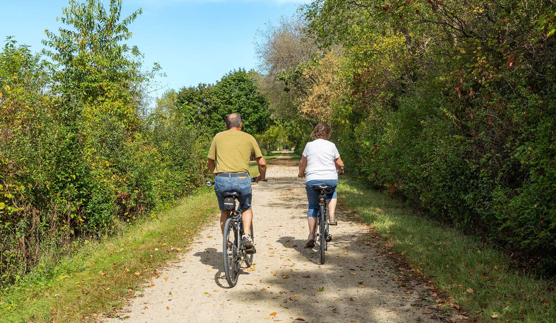 Couple bicycling on Wild Goose State Trail in Dodge County