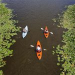 Ariel view of 3 kayakers paddling
