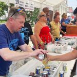 Man buying beer at Taste of Wisconsin beer festival in Beaver Dam WI