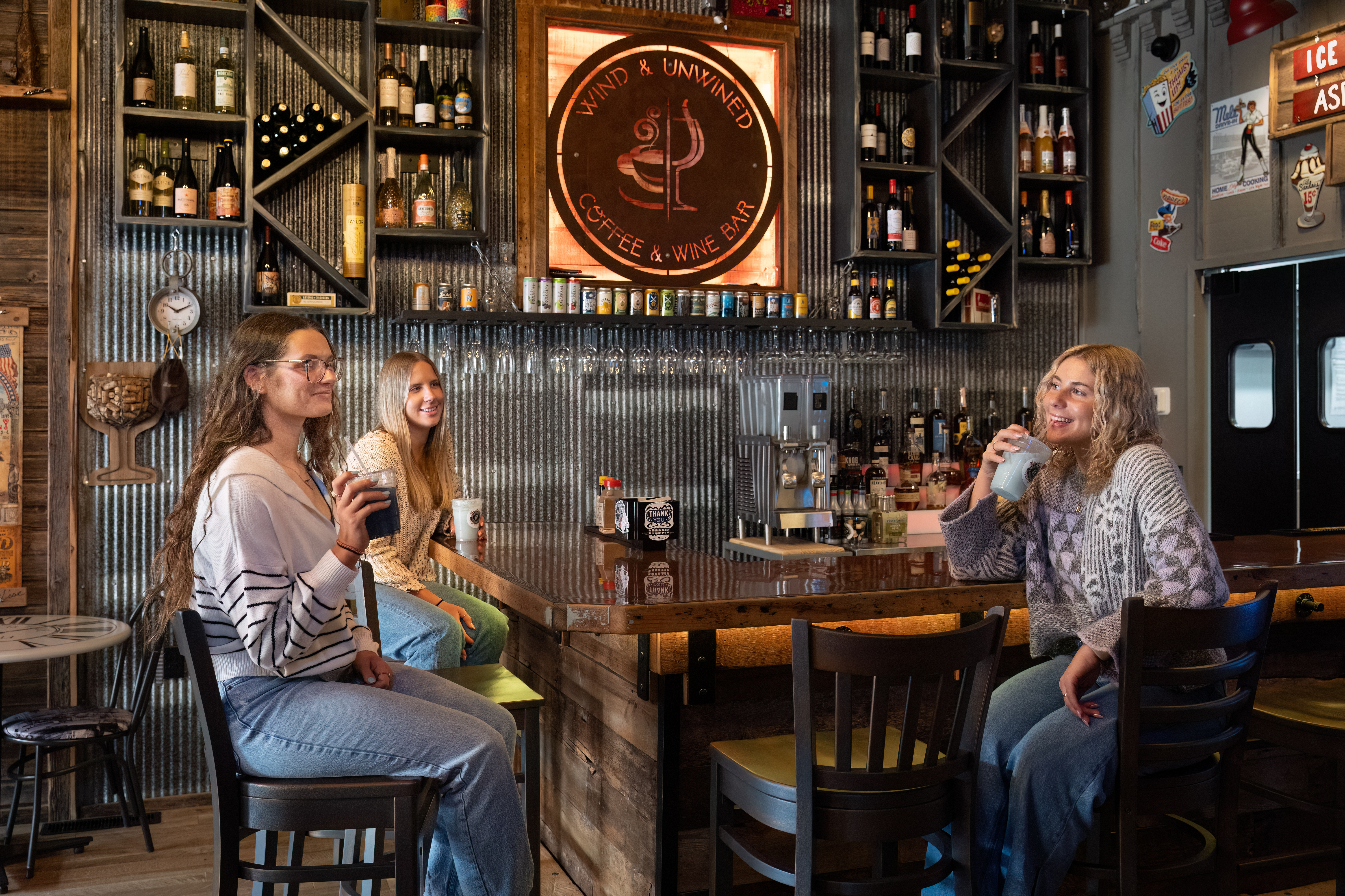 Wind and Unwined Downtown Waupun 3 girls enjoying a drink